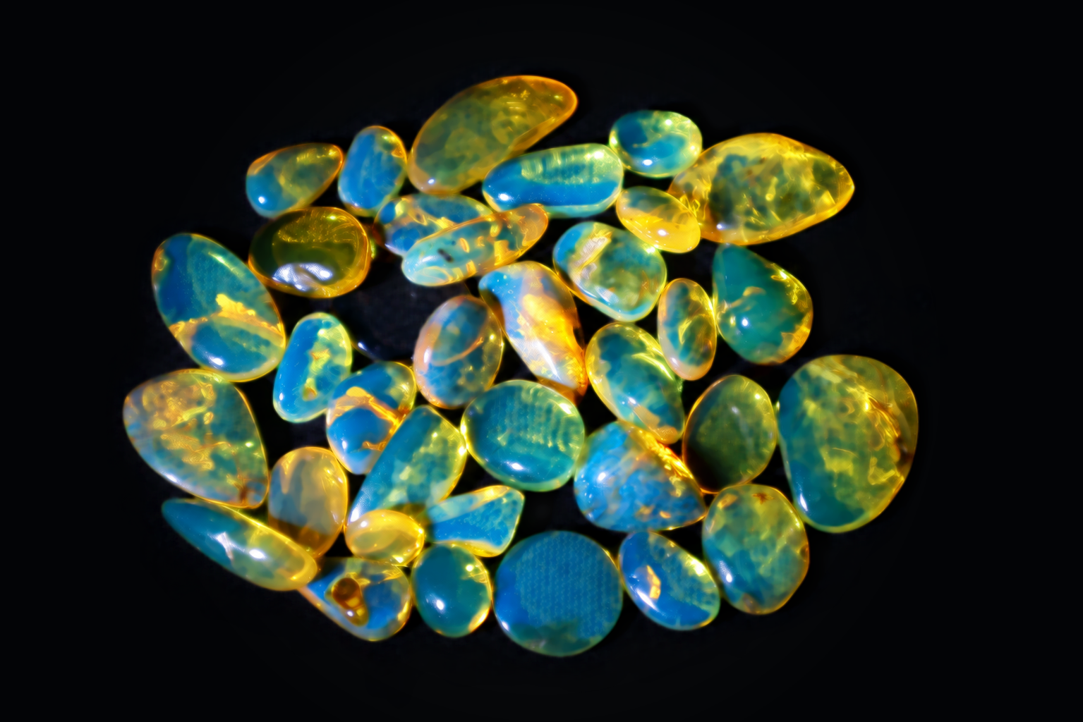 Polished blue amber cabochons in mixed sizes