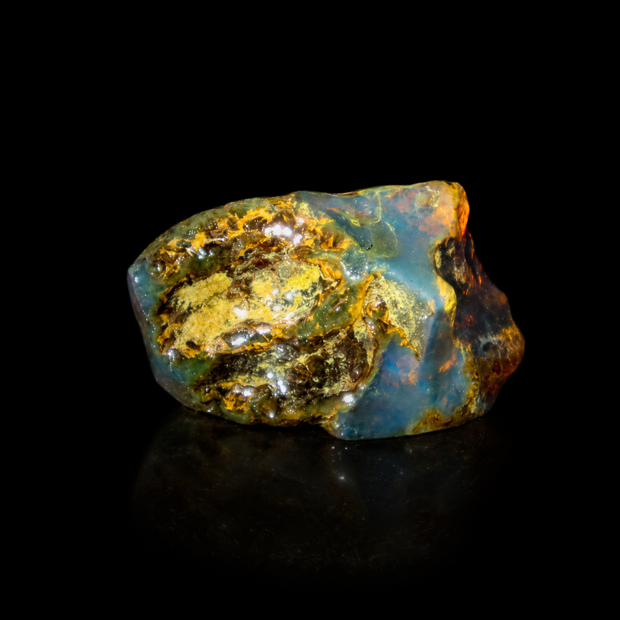 Natural Dominican blue amber rough stone with strong blue and honey optical color